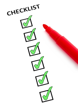 Image of a red pen filling in a checklist with six green ticks.