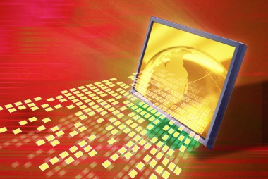 Image of a computer screen with light rays and small squares representing bits of data transmitting from it.