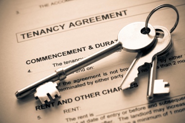 Image of a Tenancy Agreement with a set of keys.